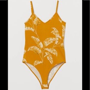 Sleeveless V neck body Suit In mustard color Sz L